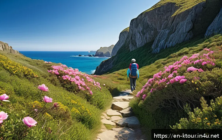 울산 대왕암공원 투어 - A serene coastal trail winding along rugged cliffs under a clear blue sky, with vibrant green coasta...